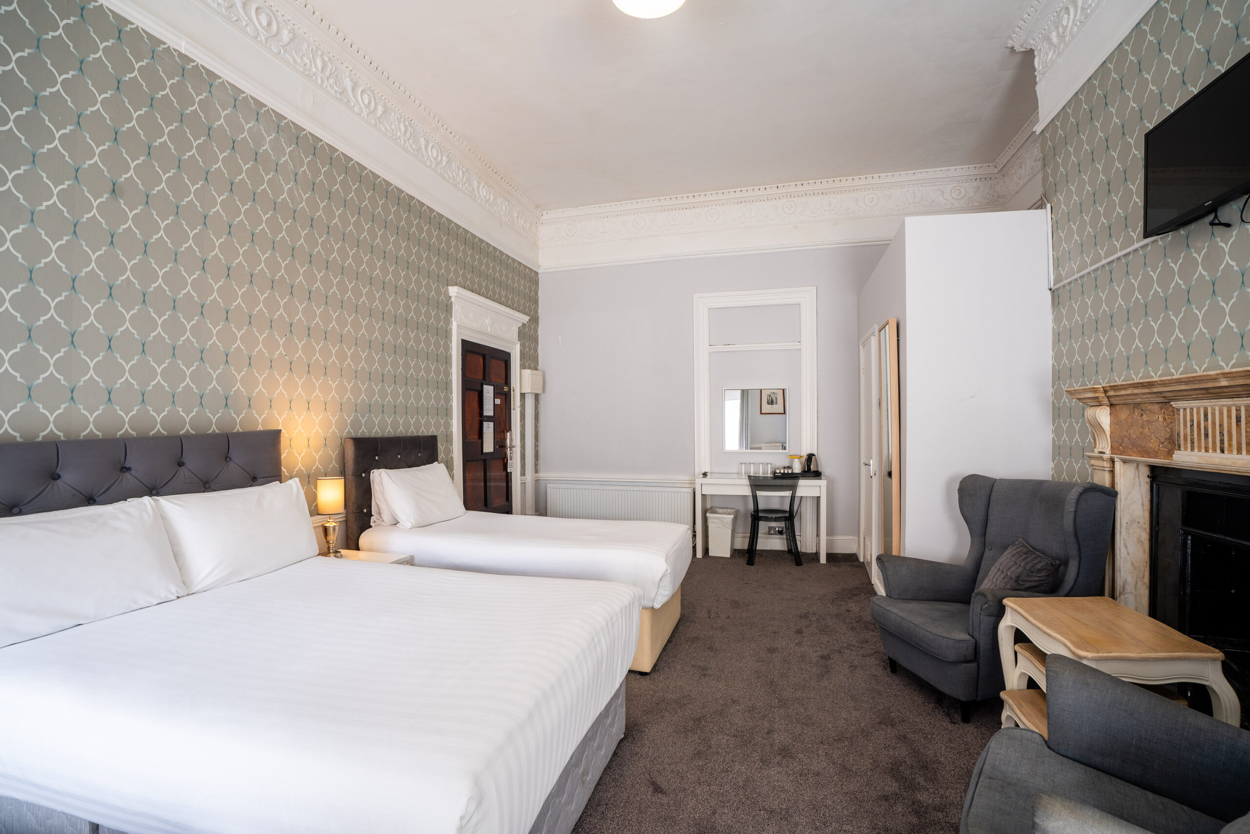 Modern Quad bedroom at Clifden Guesthouse Dublin with king-size bed and luxury linens