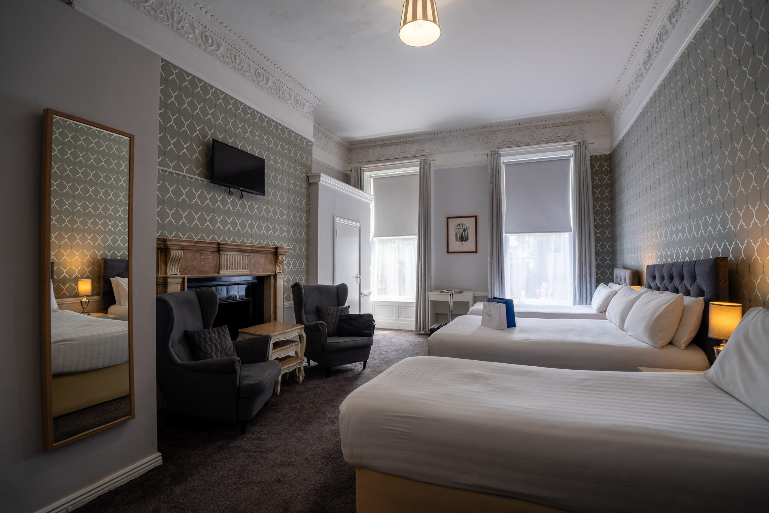 Modern Quad bedroom at Clifden Guesthouse Dublin with king-size bed and luxury linens