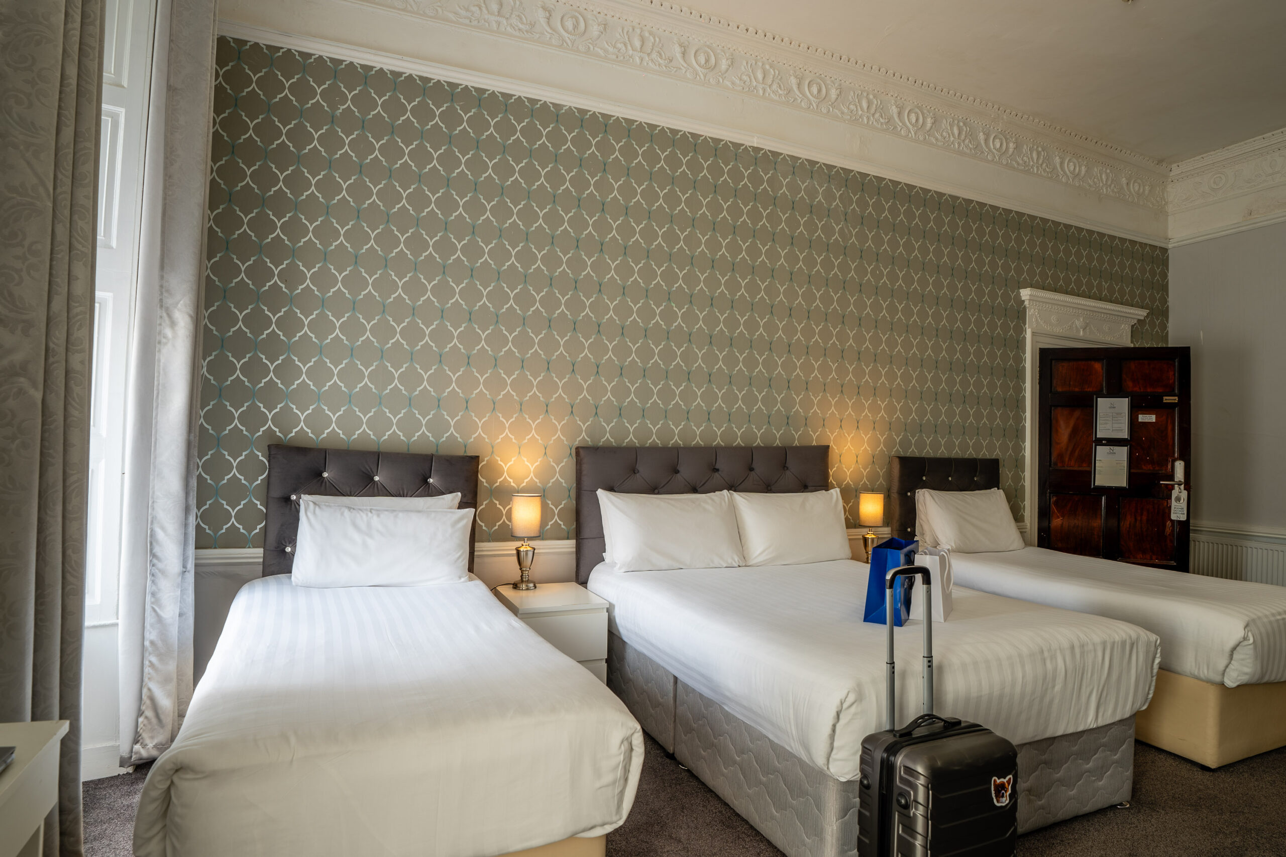 Modern Quad bedroom at Clifden Guesthouse Dublin with king-size bed and luxury linens
