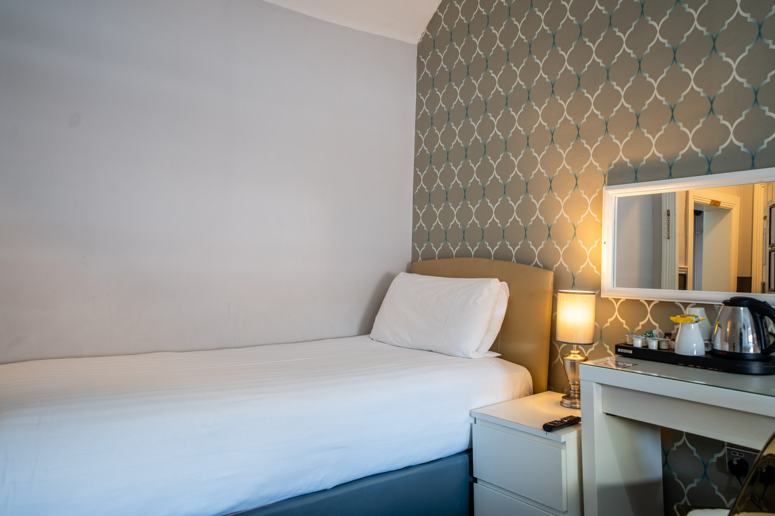 Modern single bedroom at Clifden Guesthouse Dublin with king-size bed and luxury linens